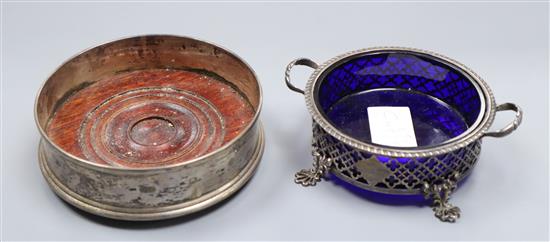 A modern silver coaster and a silver mounted butter dish.